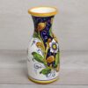 Italian Ceramic Carafe 0,5 liter, handmade and painted for wine, water and soft drinks. Side view, white flower on blue. The pattern's name is : Lemon on blue background.