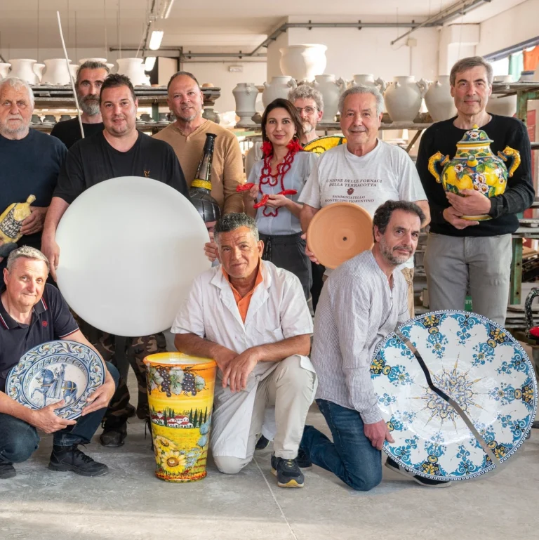 Piero Borgioli, master potter, shows his work: a broken plate that with creativity can have a new life "The light". Here with some other craftsmen